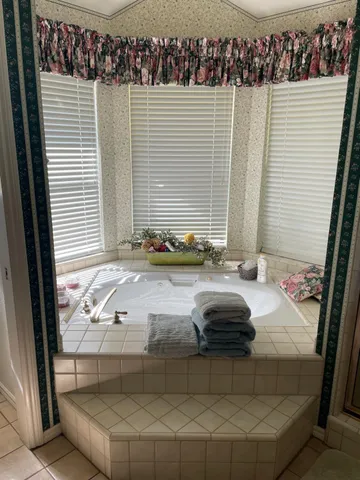 a backyard of a house with outdoor seating