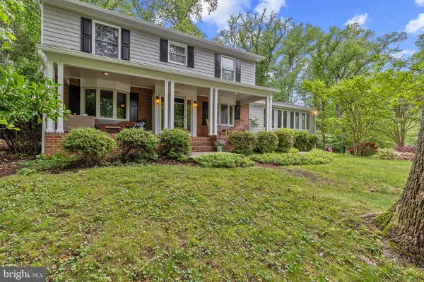 a view of a brick house with a yard