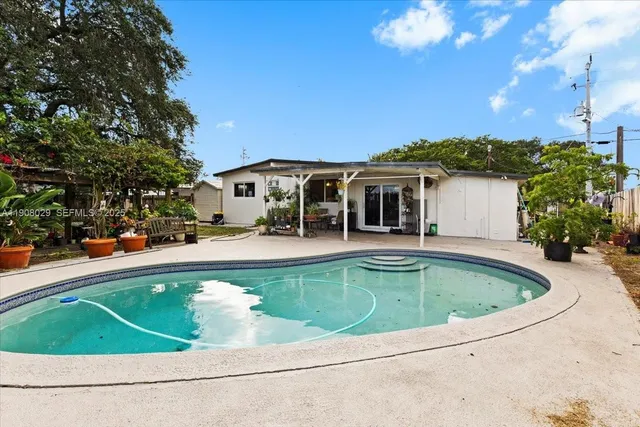 a view of a swimming pool with a patio