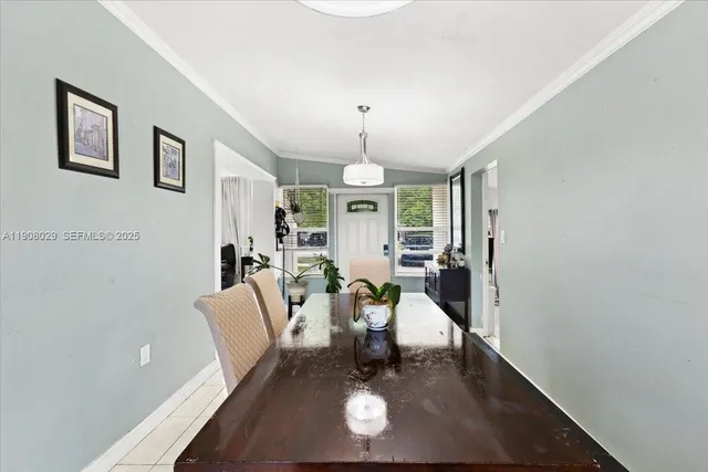 a living room with furniture a window and a chandelier