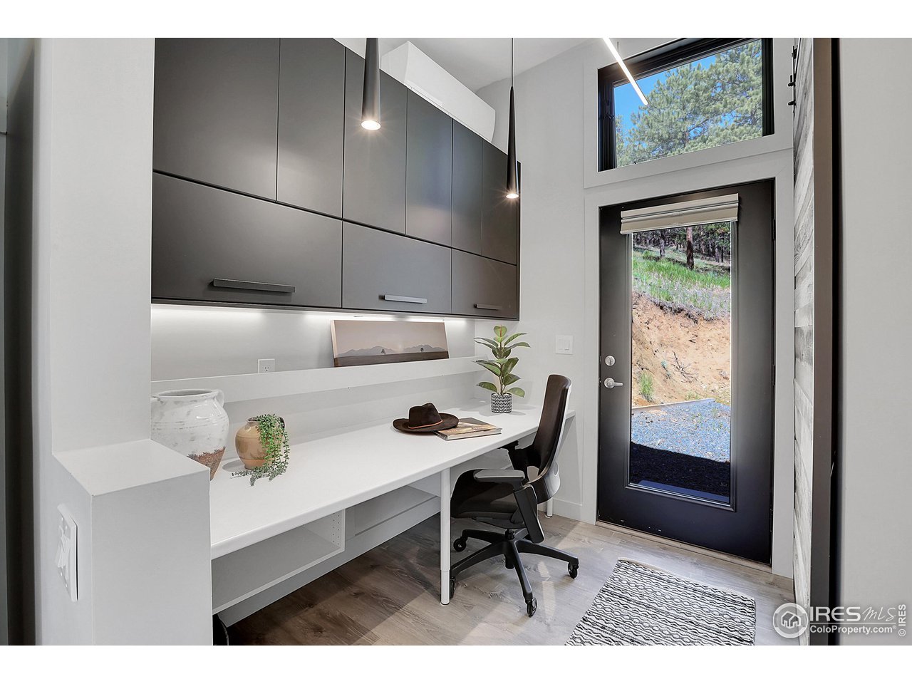 281 County Road 83 Boulder, CO 80302 - Photo 16 of 31 a kitchen with a sink cabinets and dining table