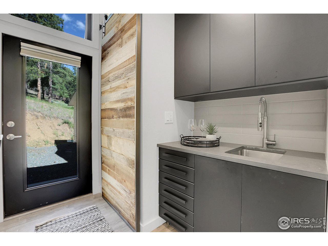 281 County Road 83 Boulder, CO 80302 - Photo 17 of 31 a kitchen with stainless steel appliances a sink stove and cabinets