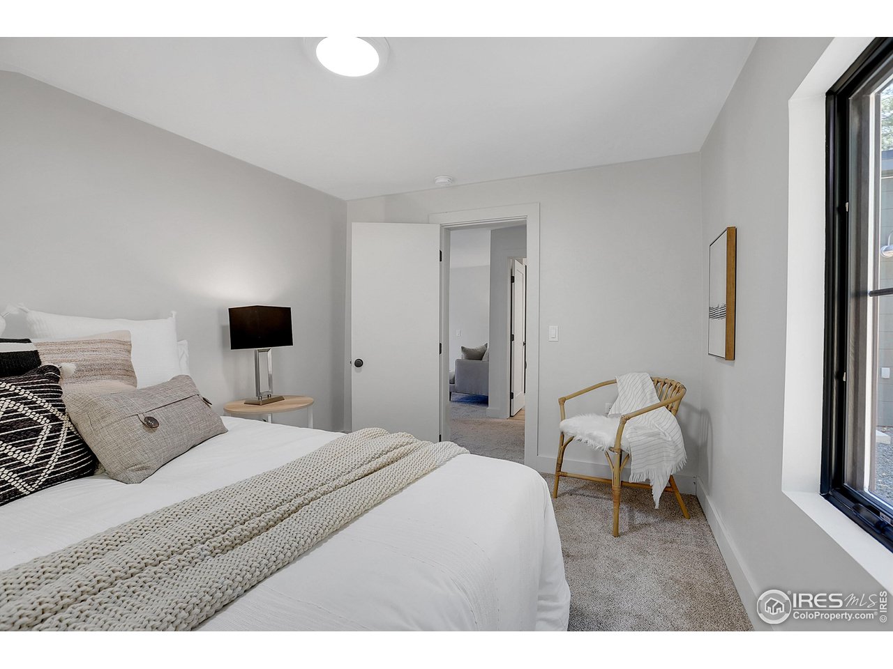 281 County Road 83 Boulder, CO 80302 - Photo 20 of 31 a bedroom with a bed and a chair