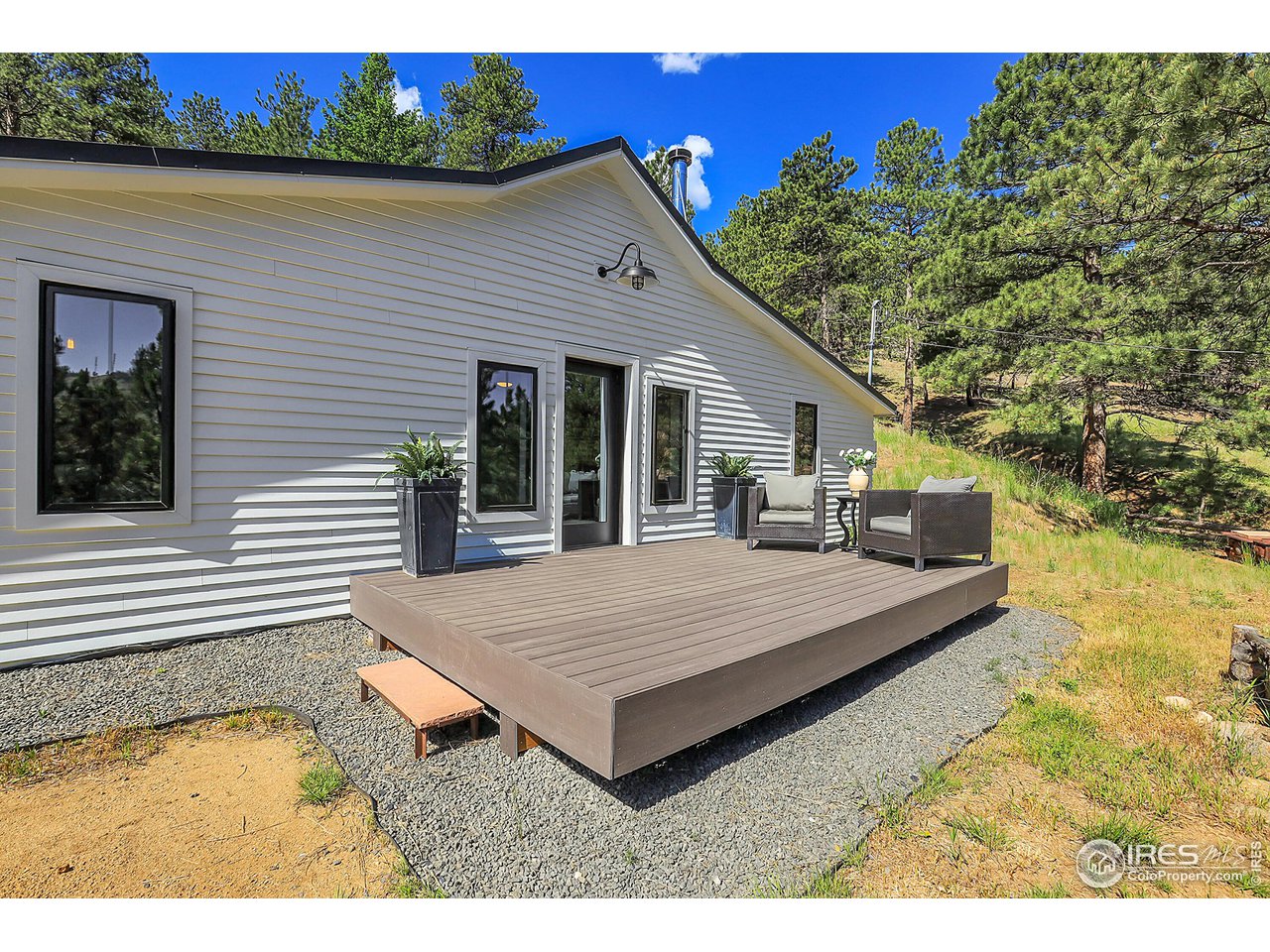281 County Road 83 Boulder, CO 80302 - Photo 25 of 31 a view of house with backyard and swimming pool