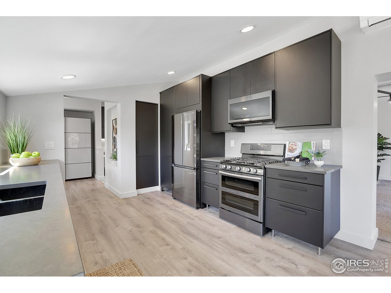281 County Road 83 Boulder, CO 80302 - Photo 9 of 31 a kitchen with stainless steel appliances kitchen island granite countertop a stove a sink and a refrigerator