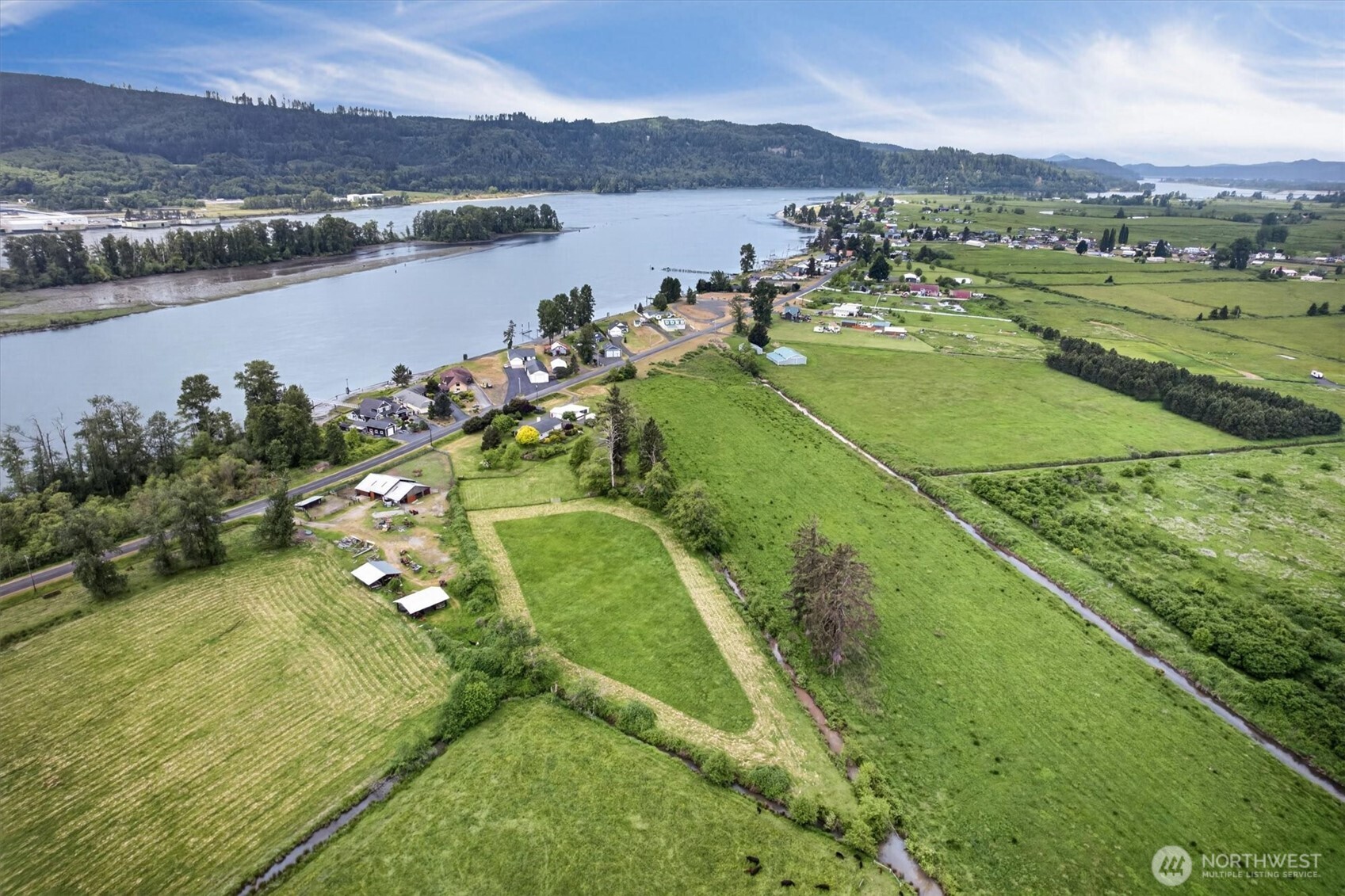 218 West Sunny Sands Road Cathlamet, WA 98612 - Photo 40 of 40 a view of a lake with a mountain in the background