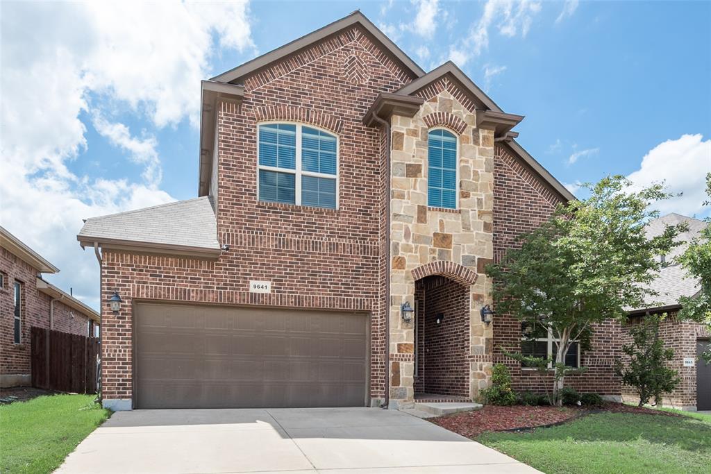 a front view of a house with yard