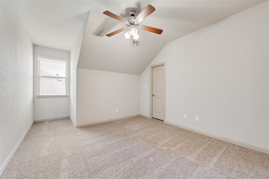 9641 Calaveras Road Fort Worth, TX 76177 - Photo 18 of 24 an empty room with chandelier fan and windows
