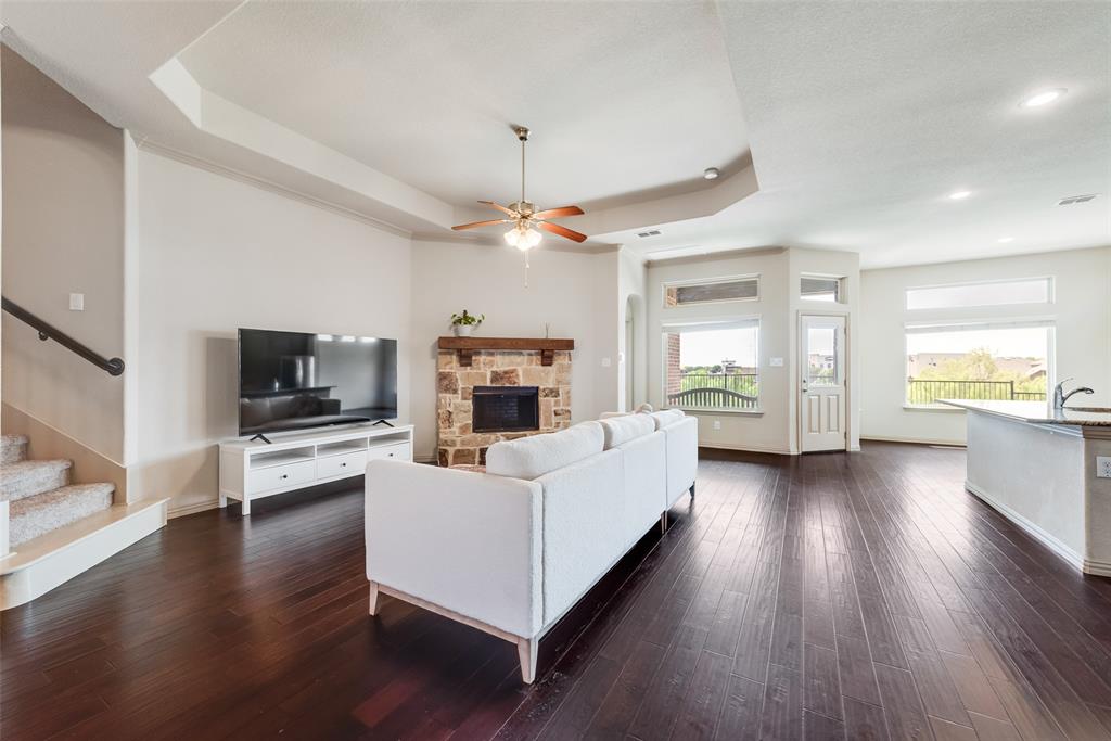 9641 Calaveras Road Fort Worth, TX 76177 - Photo 3 of 24 a living room with furniture fireplace and flat screen tv