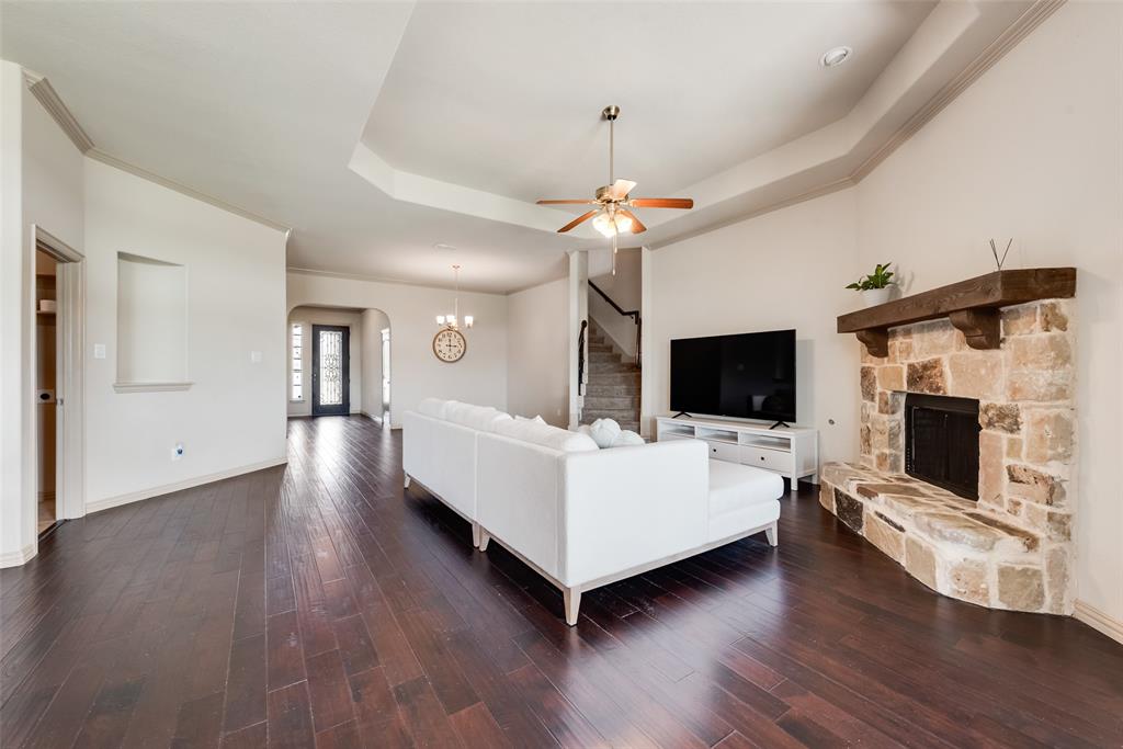 9641 Calaveras Road Fort Worth, TX 76177 - Photo 5 of 24 a living room with furniture fireplace and flat screen tv