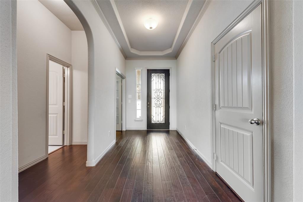 9641 Calaveras Road Fort Worth, TX 76177 - Photo 7 of 24 a view of a hallway with wooden floor