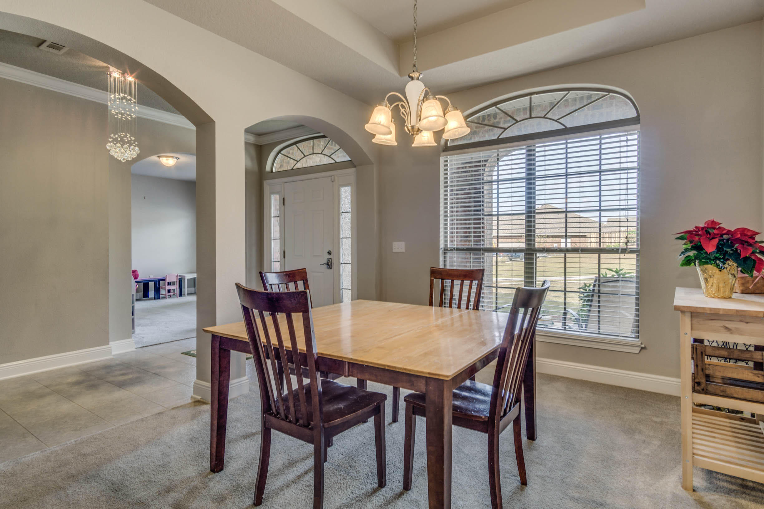 644 Red Fern Road Crestview, FL 32536 - Photo 11 of 46 a view of a dining room with furniture and a chandelier