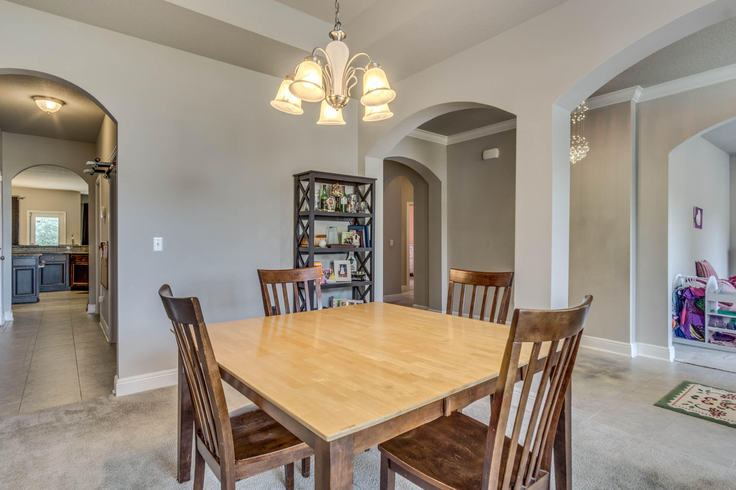 644 Red Fern Road Crestview, FL 32536 - Photo 12 of 46 a view of a dining room with furniture and chandelier
