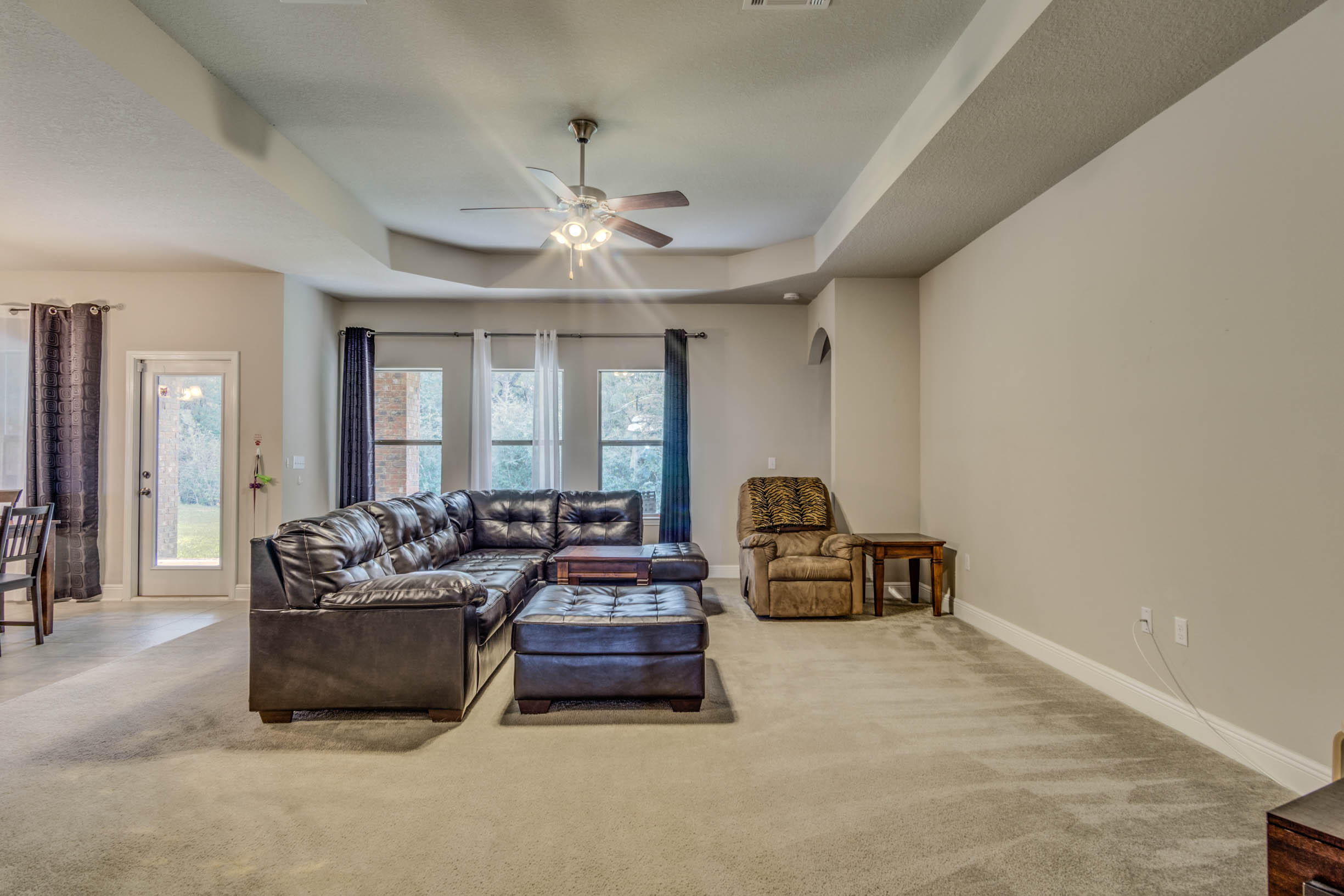 644 Red Fern Road Crestview, FL 32536 - Photo 14 of 46 a living room with furniture and a large window