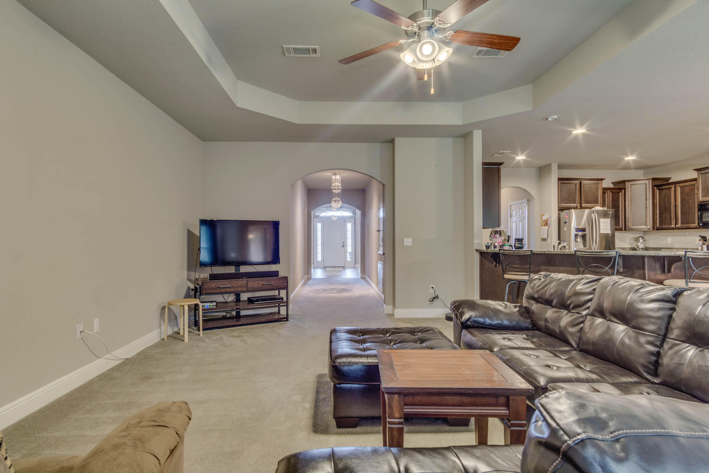 644 Red Fern Road Crestview, FL 32536 - Photo 16 of 46 a living room with furniture and a flat screen tv