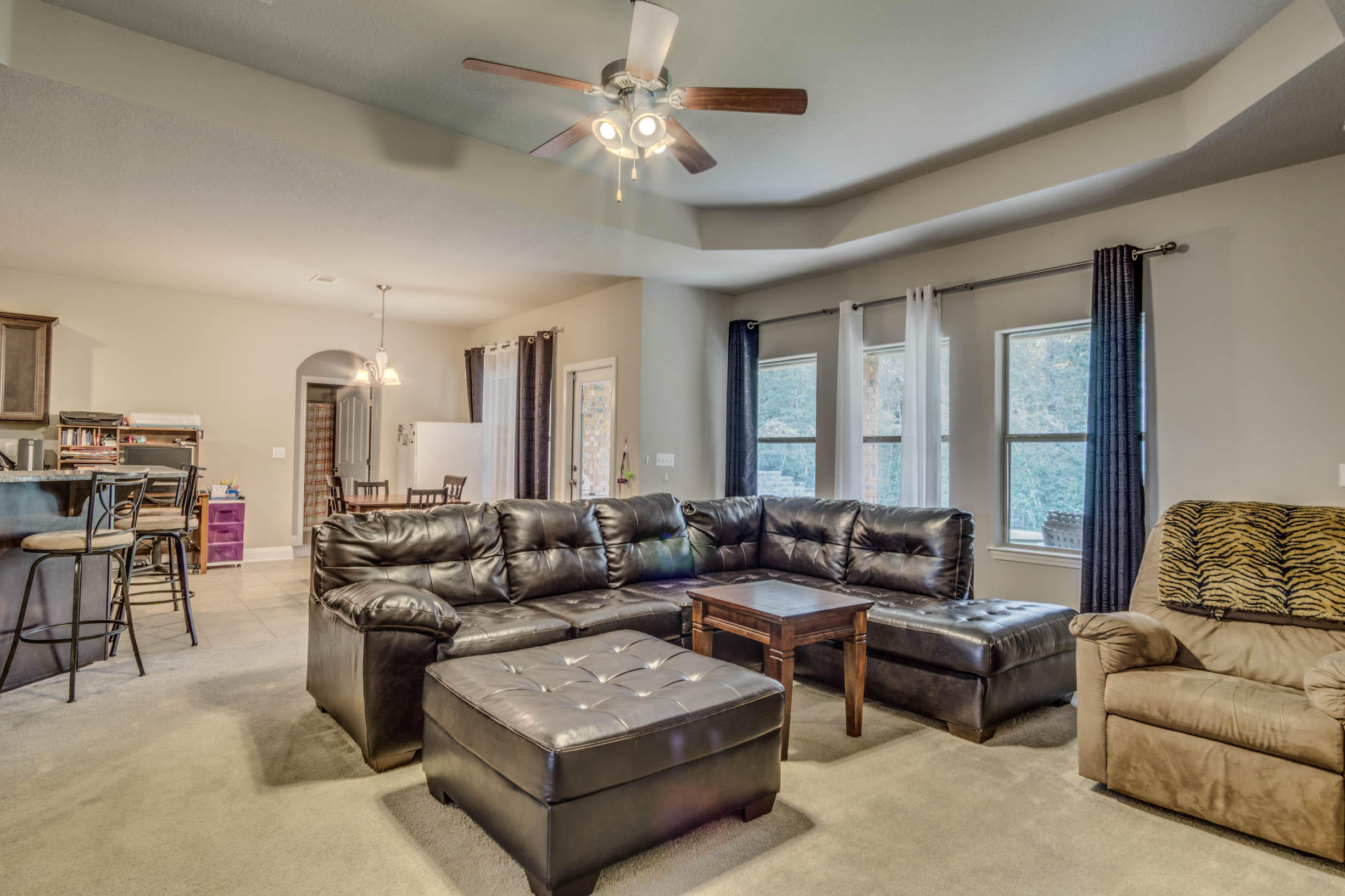 644 Red Fern Road Crestview, FL 32536 - Photo 18 of 46 a living room with furniture and a large window