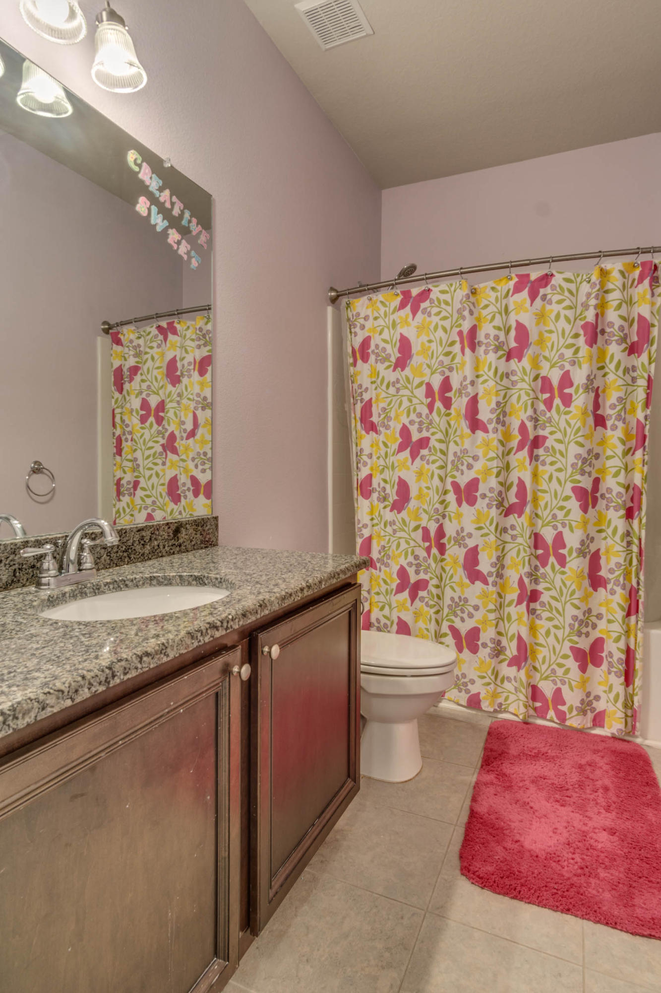 644 Red Fern Road Crestview, FL 32536 - Photo 27 of 46 a bathroom with a granite countertop sink and a mirror