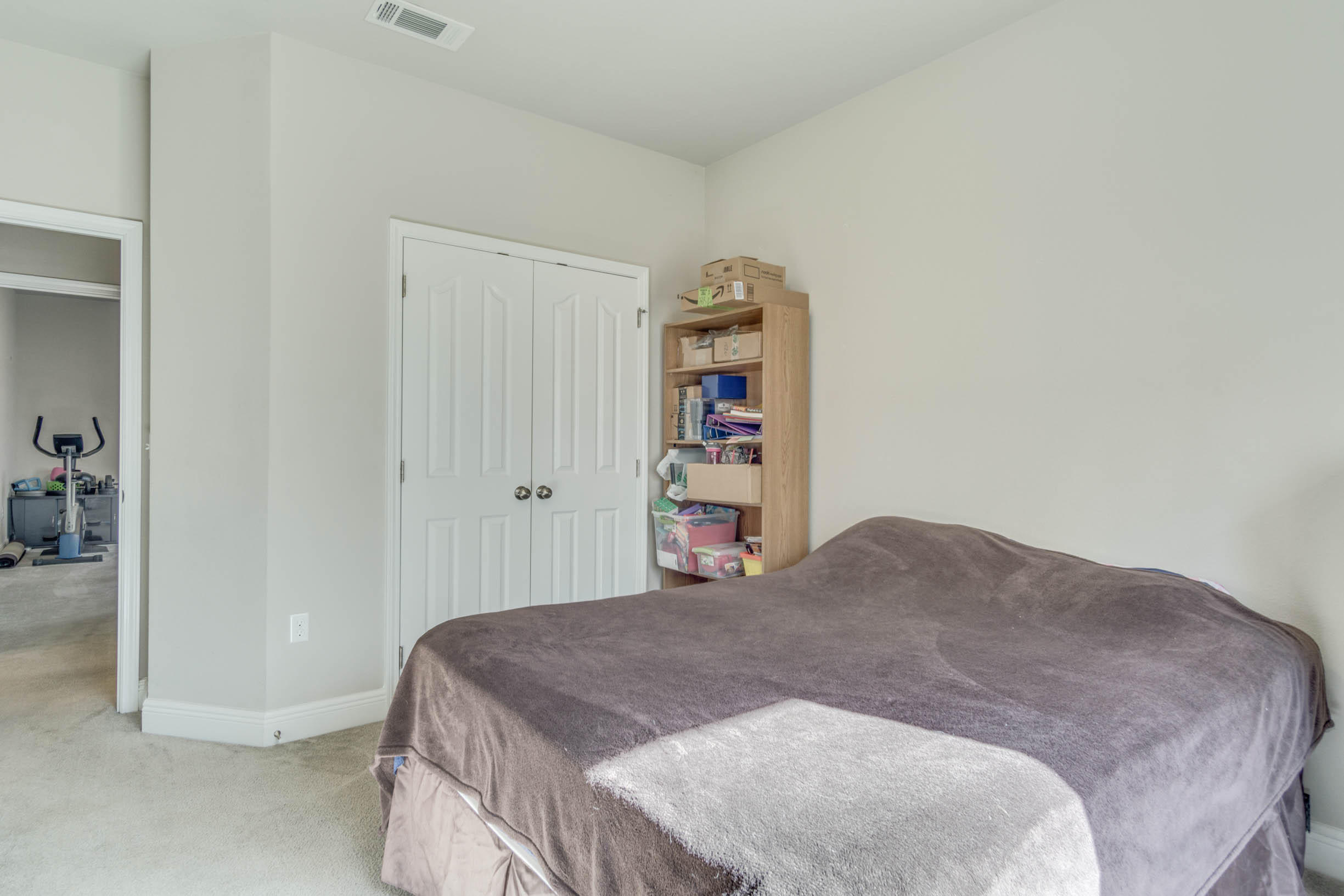 644 Red Fern Road Crestview, FL 32536 - Photo 34 of 46 a bedroom with a bed and book shelf