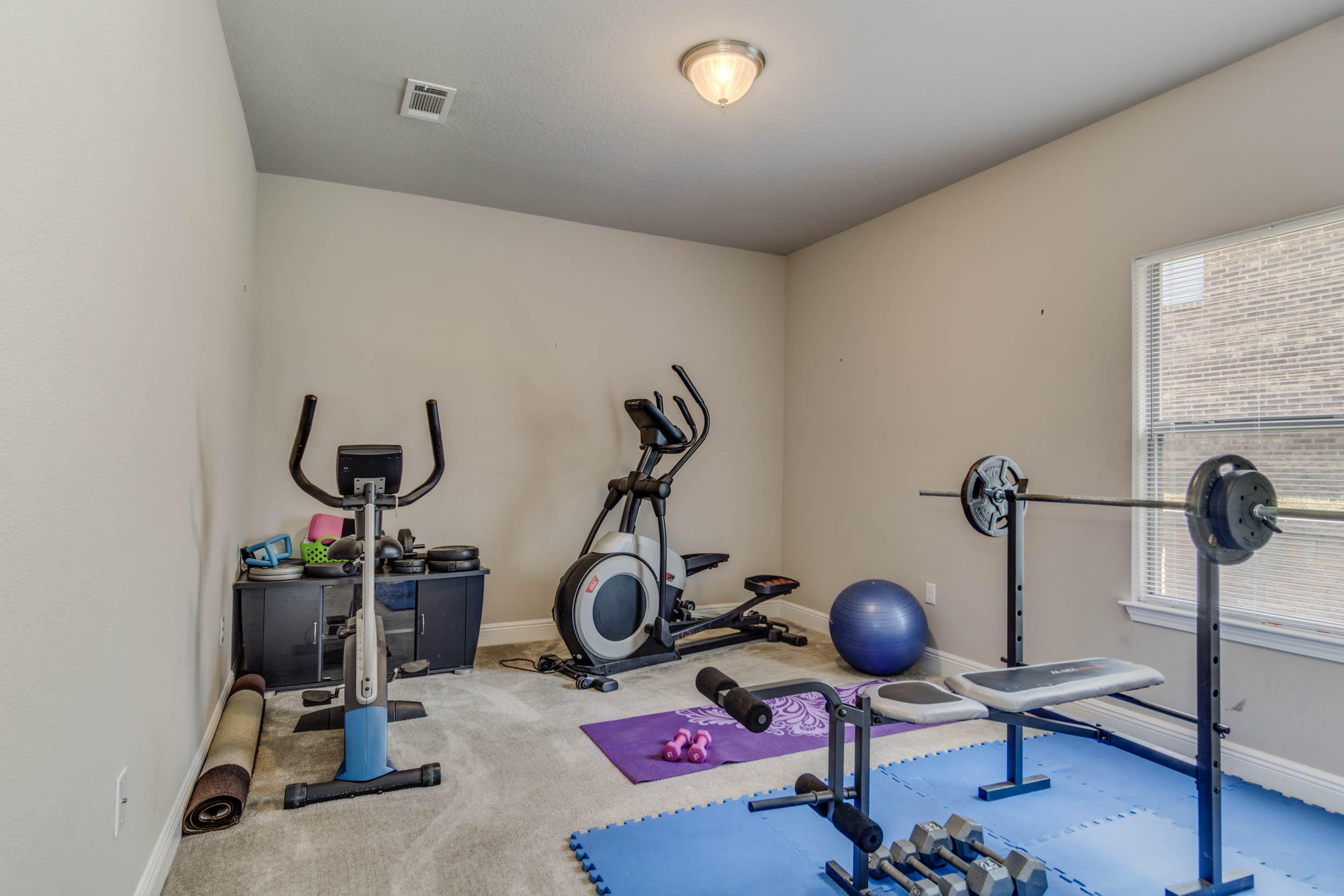 644 Red Fern Road Crestview, FL 32536 - Photo 36 of 46 a view of a room with gym equipment