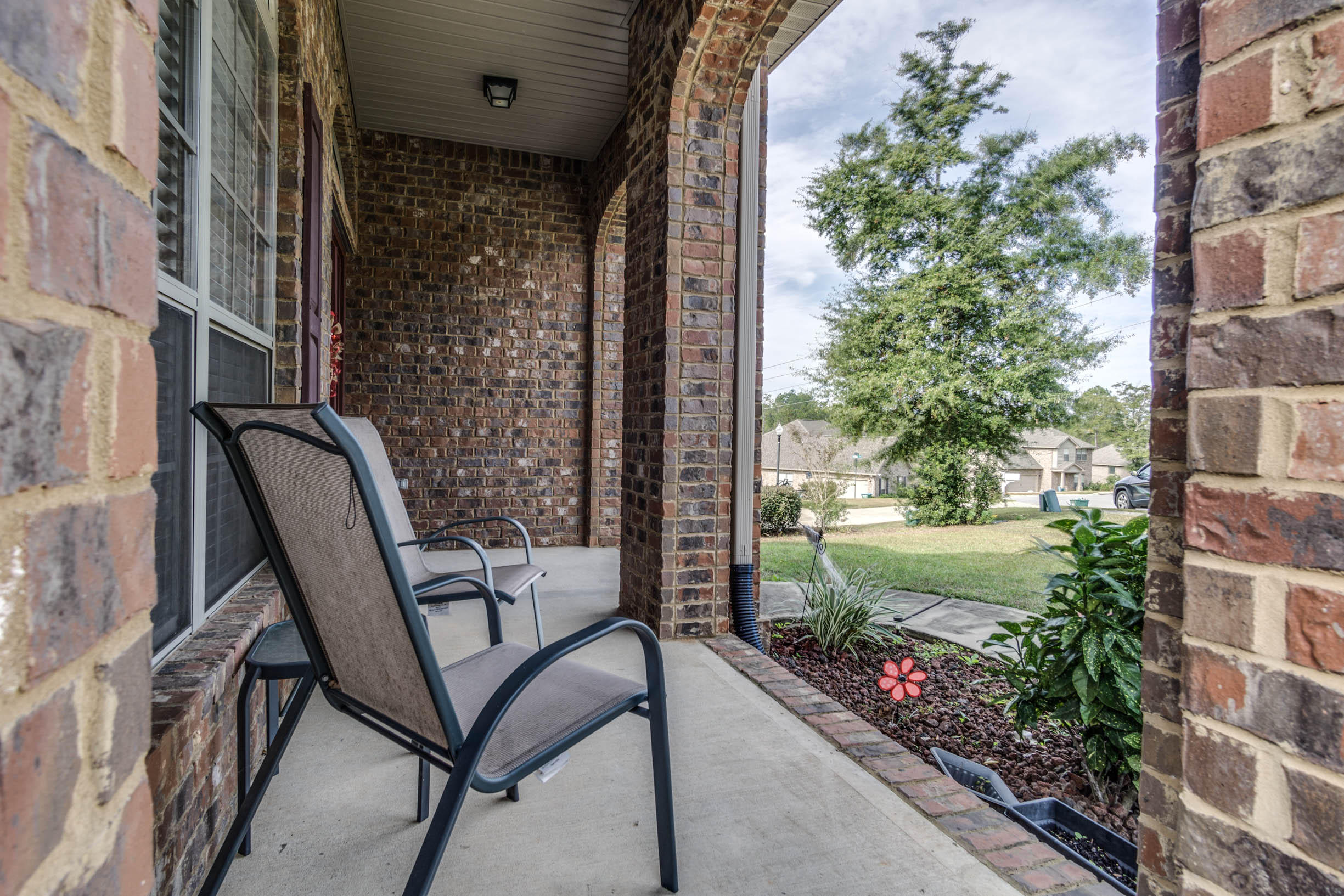644 Red Fern Road Crestview, FL 32536 - Photo 5 of 46 a balcony view with couple of chairs and potted plants