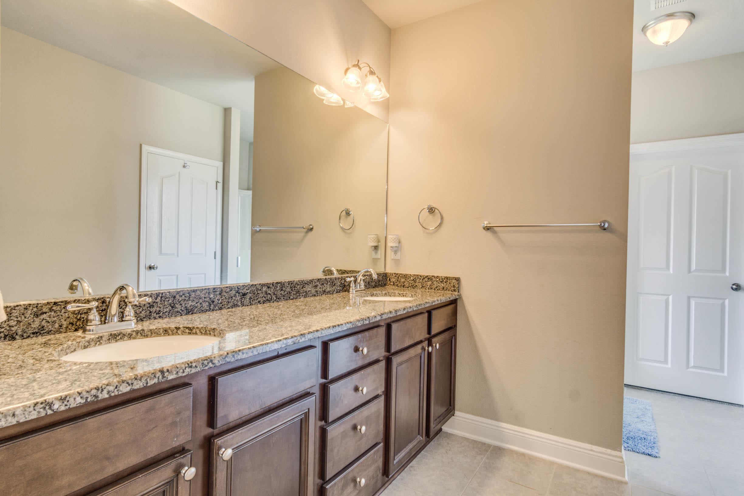 644 Red Fern Road Crestview, FL 32536 - Photo 41 of 46 a bathroom with a granite countertop sink and a mirror