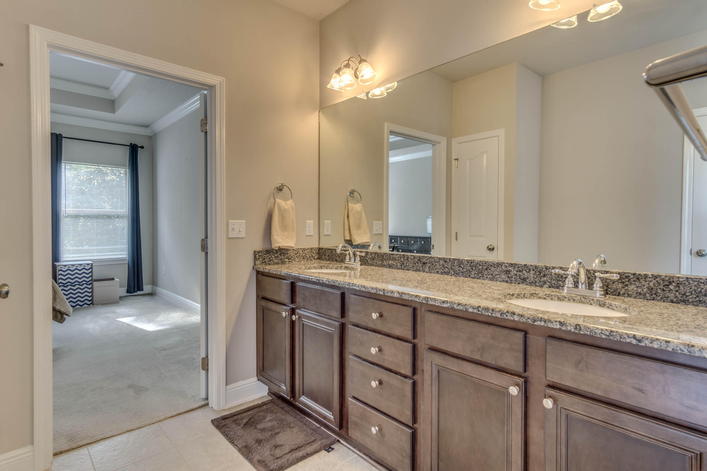 644 Red Fern Road Crestview, FL 32536 - Photo 43 of 46 a bathroom with a granite countertop sink and a mirror