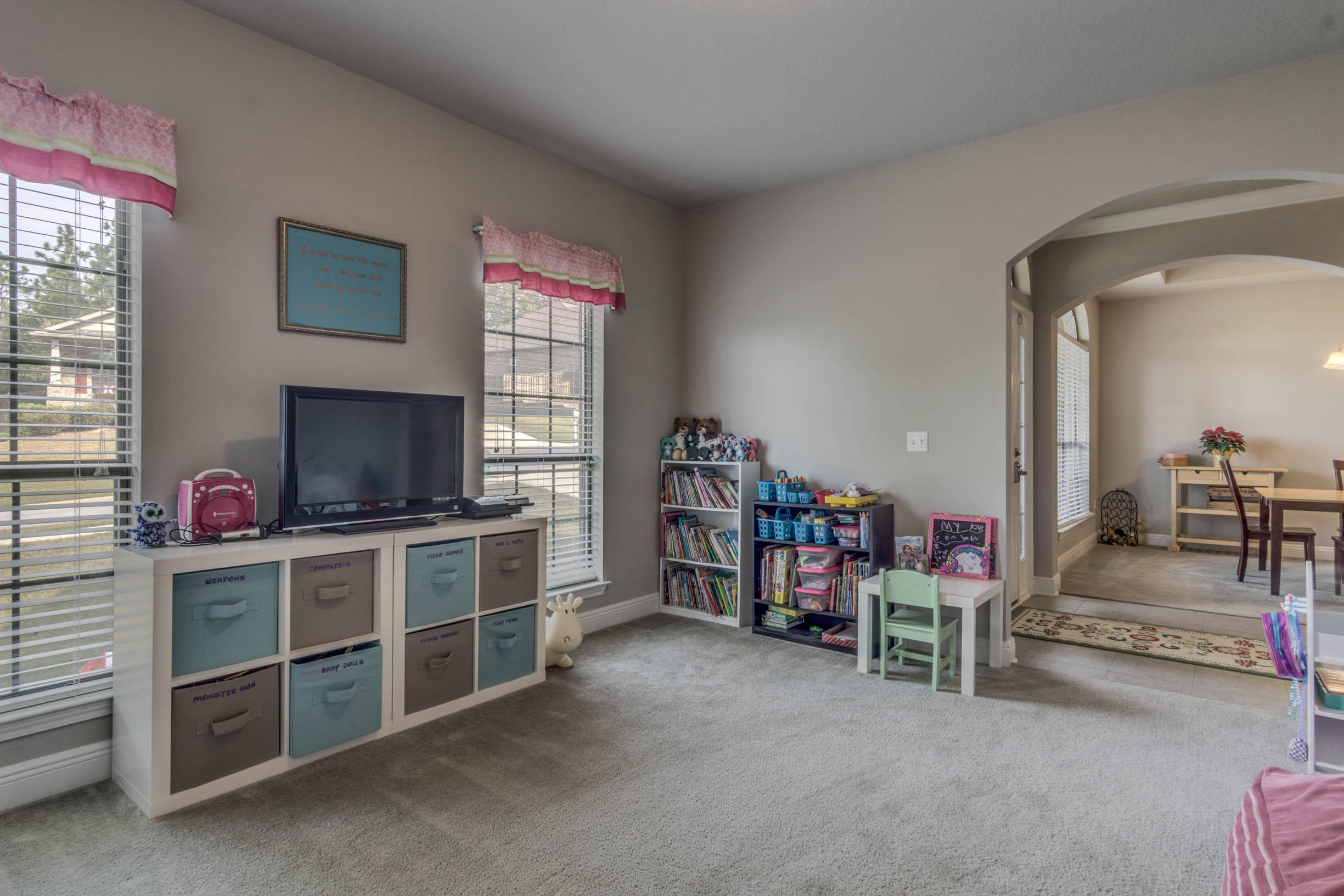 644 Red Fern Road Crestview, FL 32536 - Photo 9 of 46 a living room with furniture and a flat screen tv