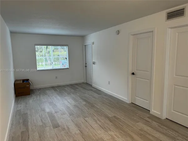 a view of an empty room and window