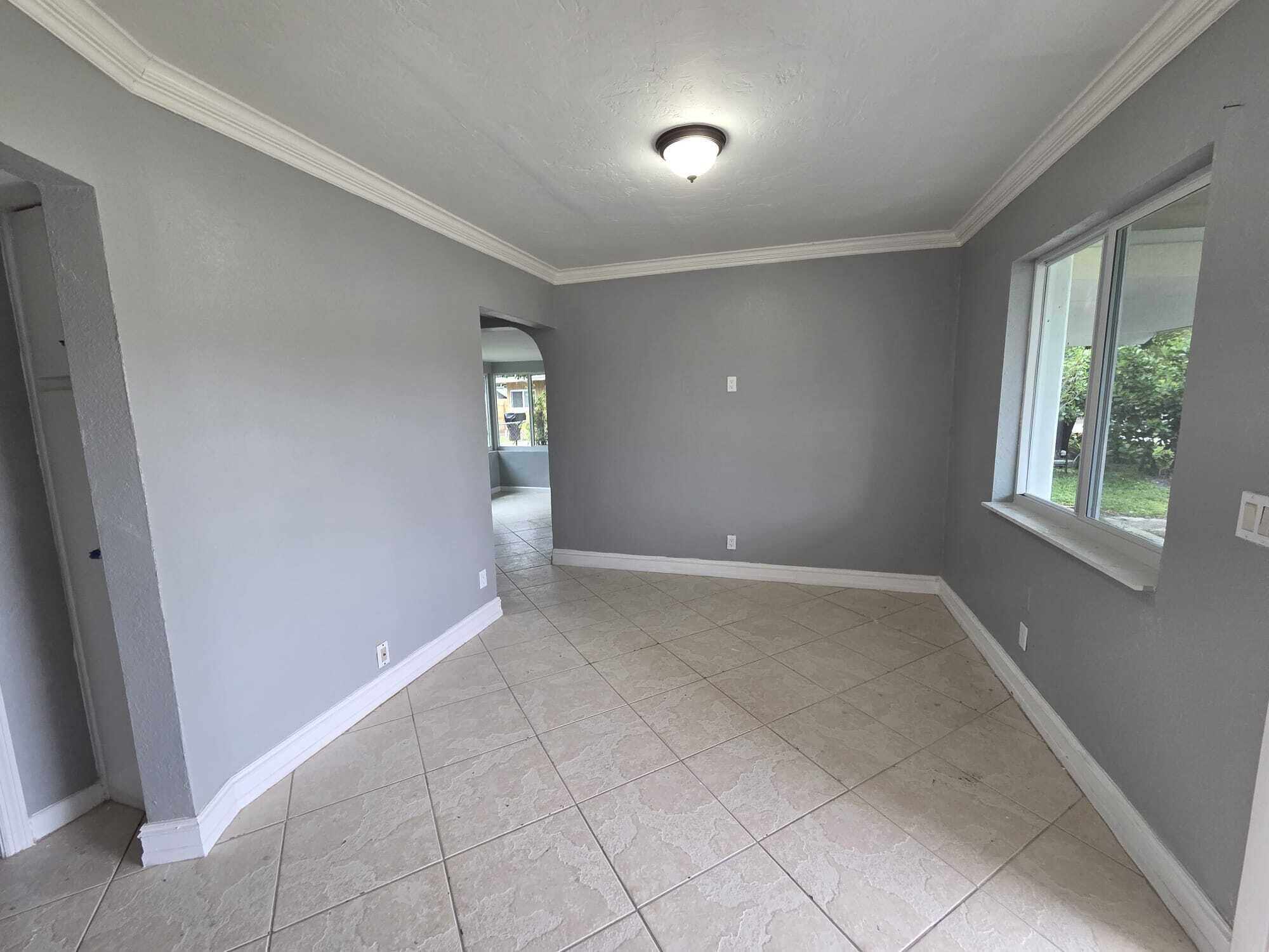 5720 Cleveland Street Hollywood, FL 33021 - Photo 11 of 18 an empty room with windows