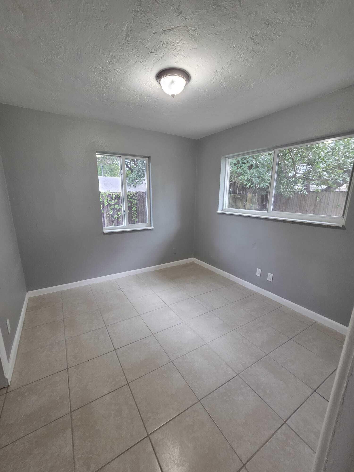 5720 Cleveland Street Hollywood, FL 33021 - Photo 12 of 18 a view of an empty room with a window