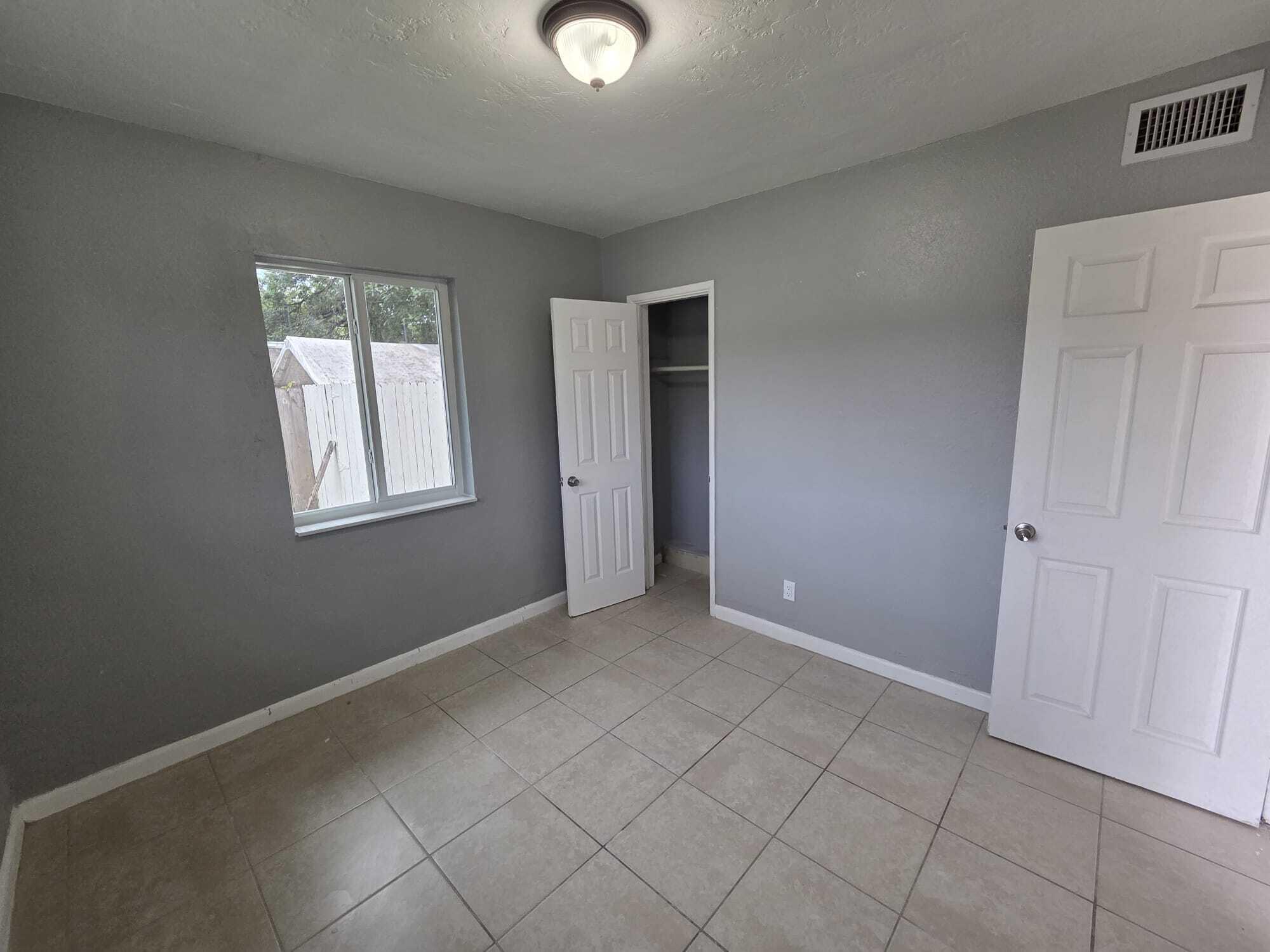 5720 Cleveland Street Hollywood, FL 33021 - Photo 14 of 18 an empty room with windows
