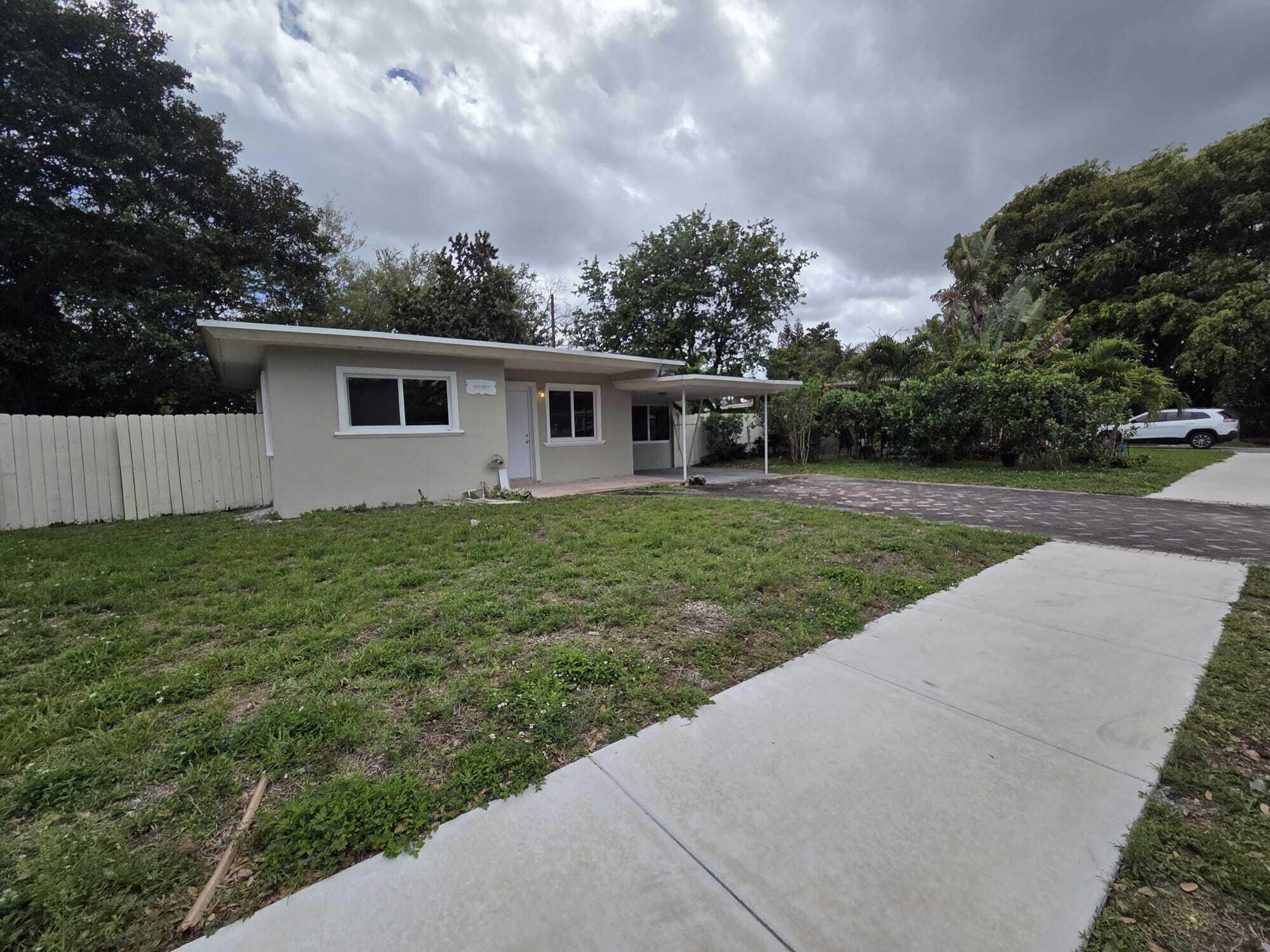 5720 Cleveland Street Hollywood, FL 33021 - Photo 6 of 18 a view of a house with a yard