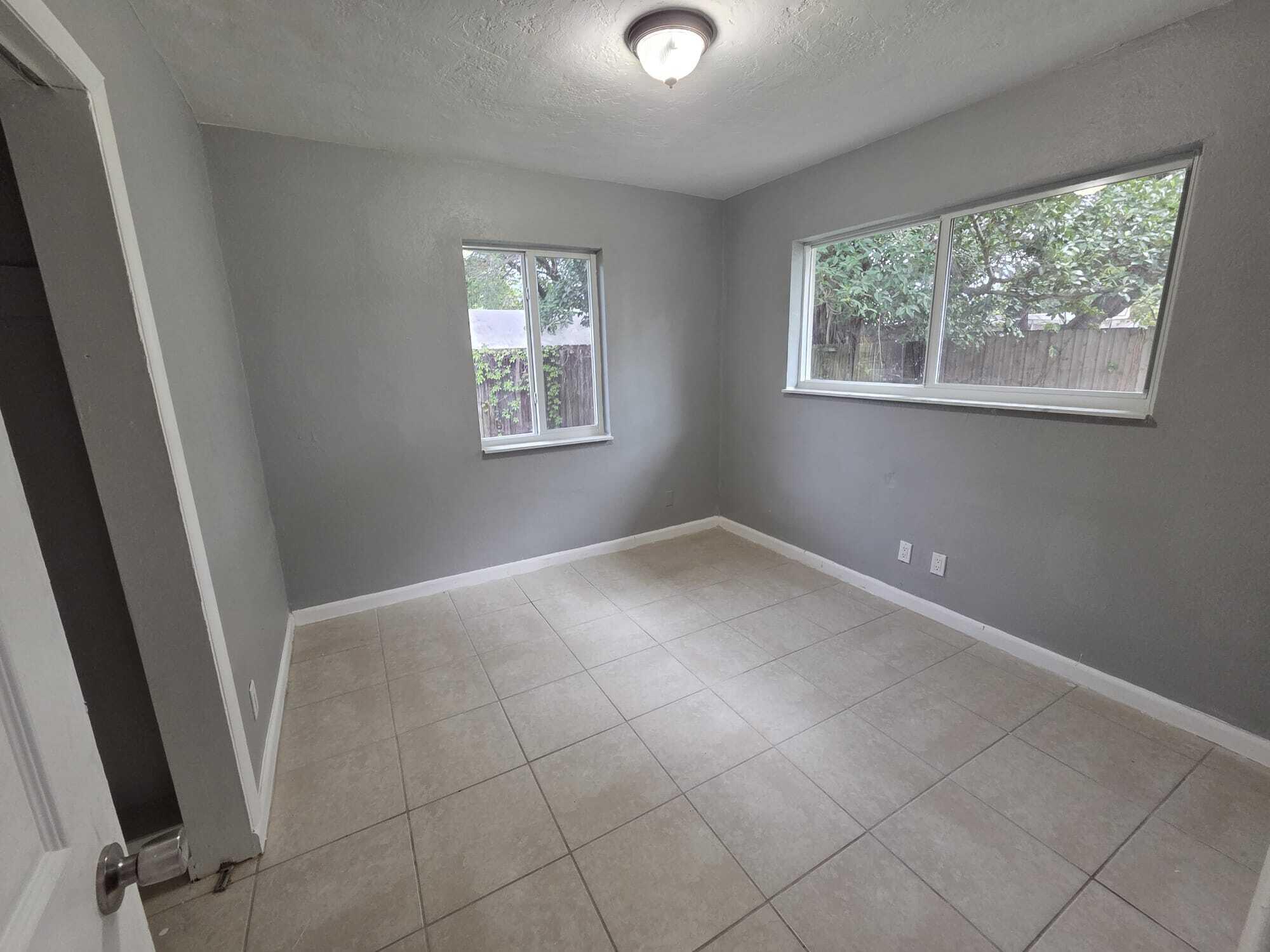 5720 Cleveland Street Hollywood, FL 33021 - Photo 10 of 18 a view of an empty room with a window