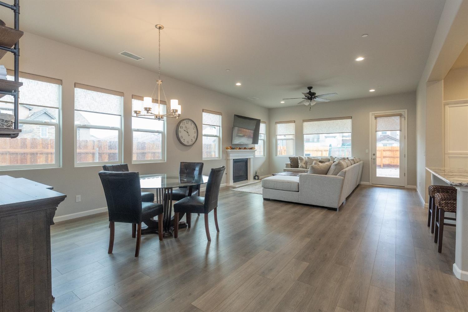 1063 Soledad Avenue Clovis, CA 93619 - Photo 2 of 26 a view of a dining room with furniture window and wooden floor
