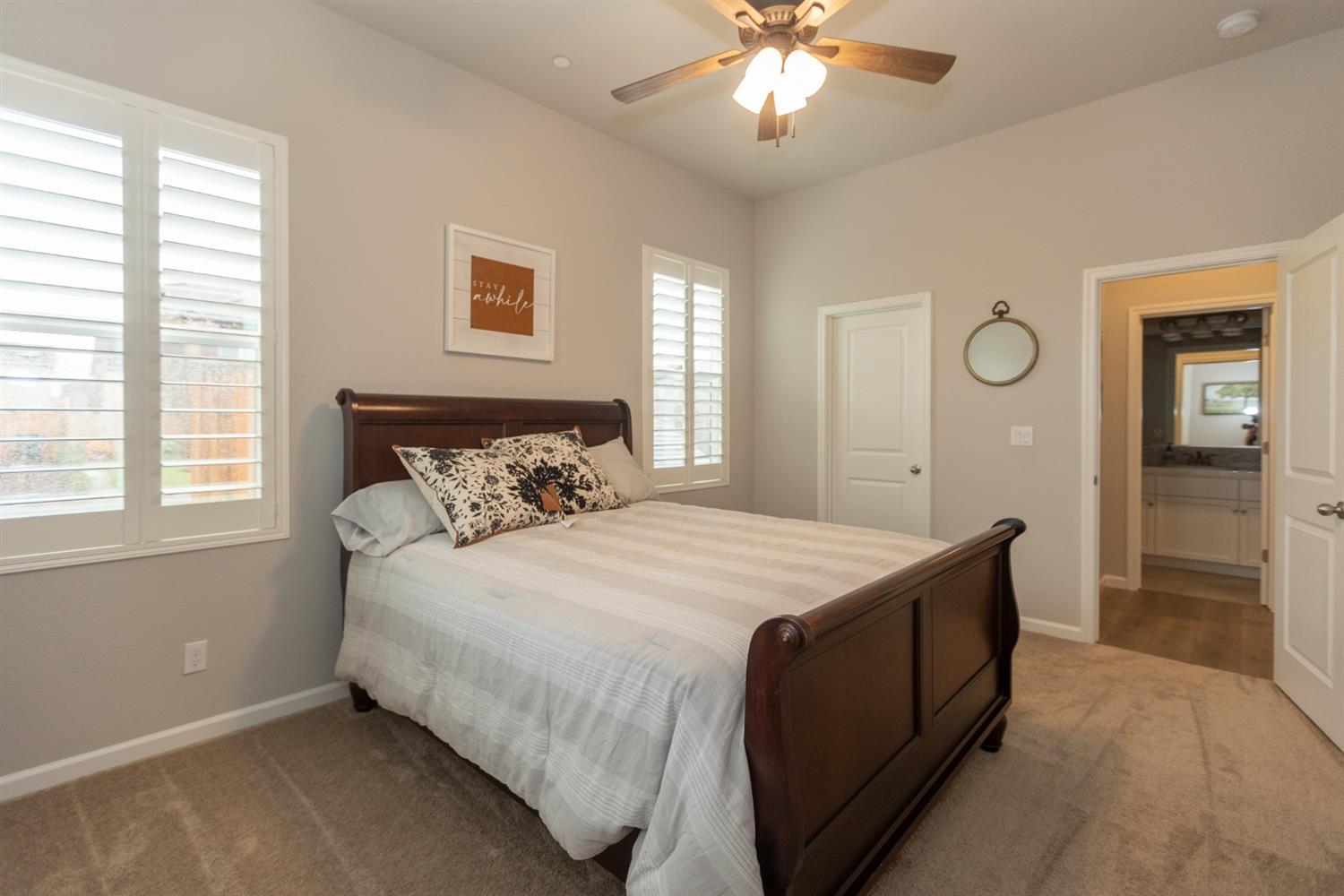 1063 Soledad Avenue Clovis, CA 93619 - Photo 14 of 26 a bedroom with a bed and a chandelier