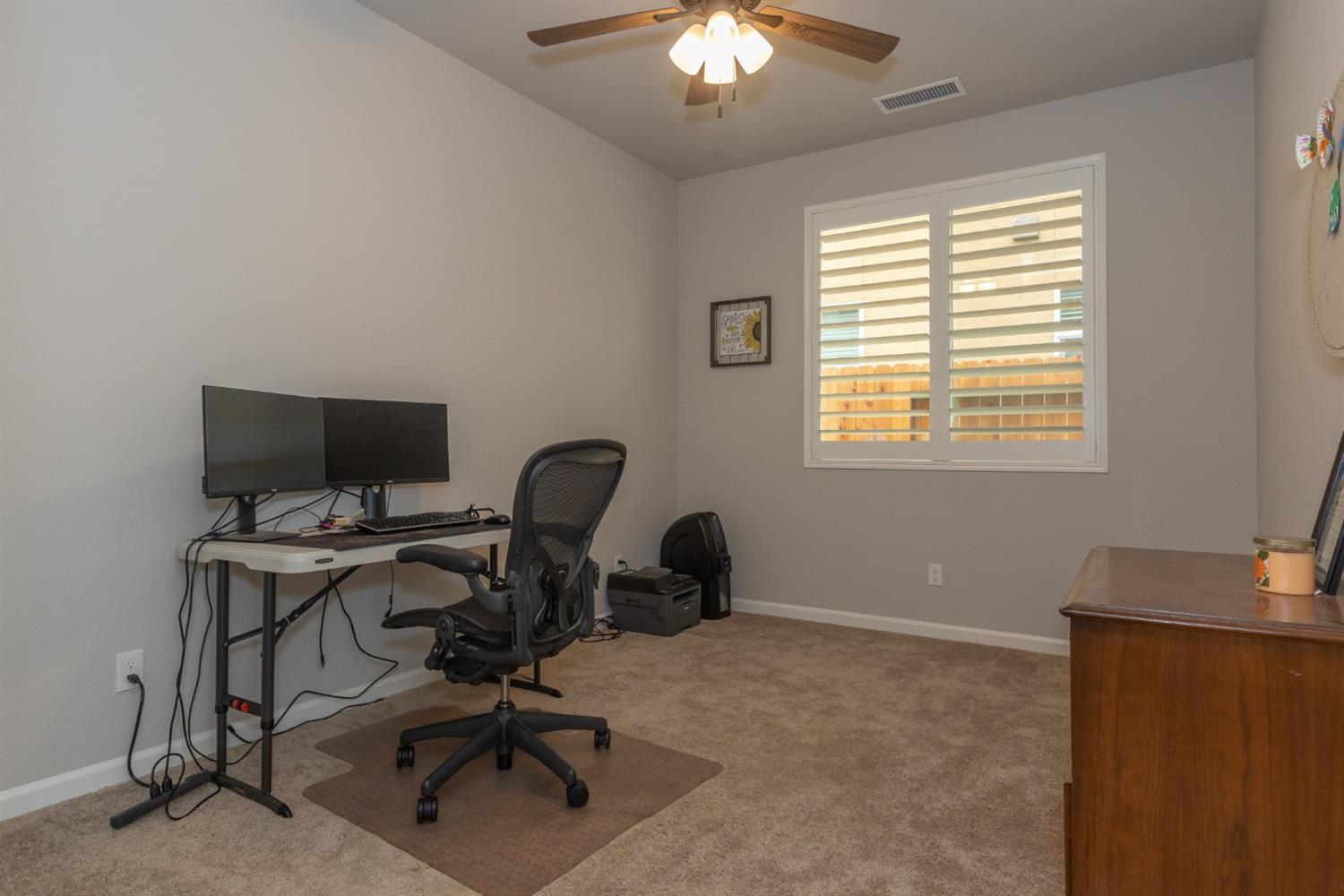 1063 Soledad Avenue Clovis, CA 93619 - Photo 18 of 26 a view of a workspace with furniture and a window