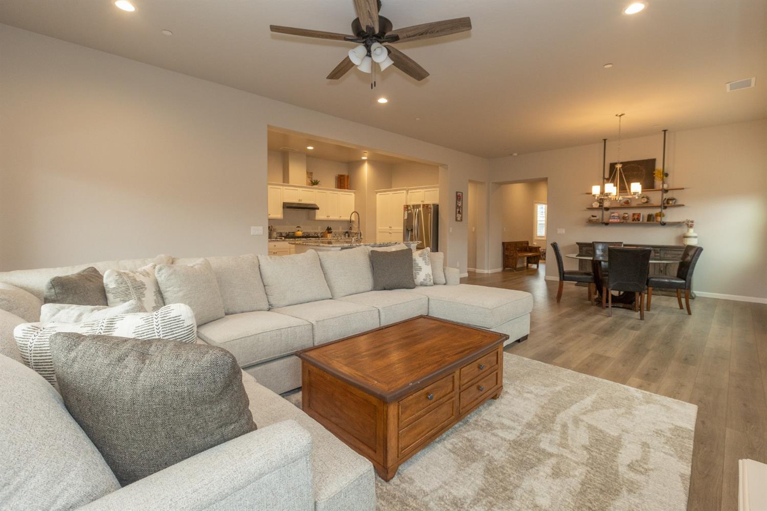 1063 Soledad Avenue Clovis, CA 93619 - Photo 4 of 26 a living room with furniture kitchen view and a chandelier