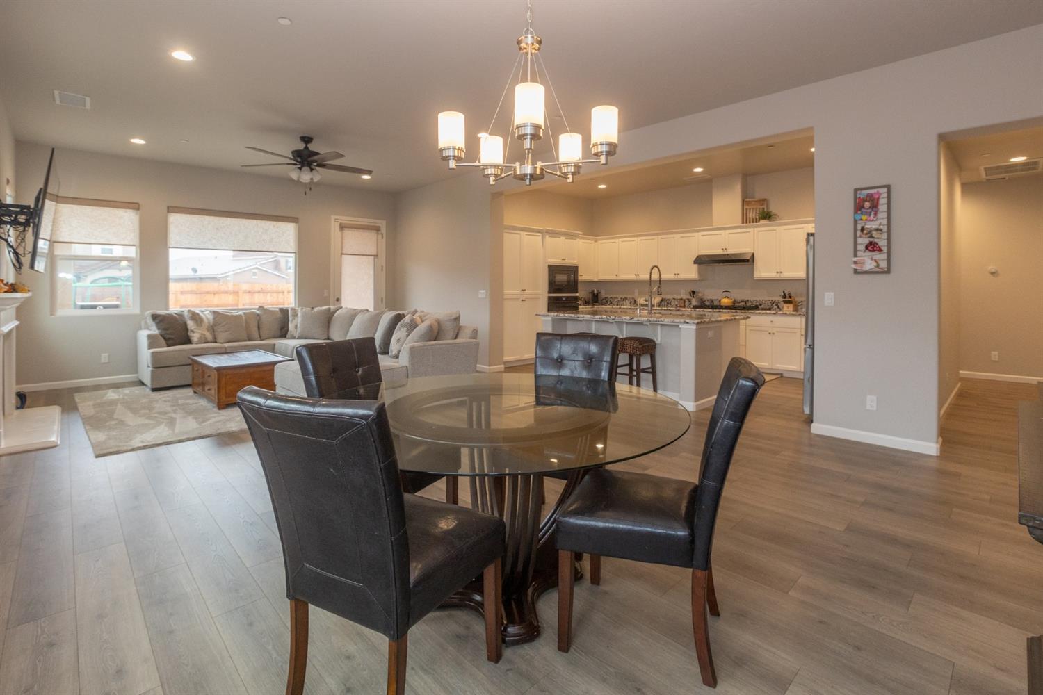 1063 Soledad Avenue Clovis, CA 93619 - Photo 7 of 26 a view of a dining room with furniture and wooden floor