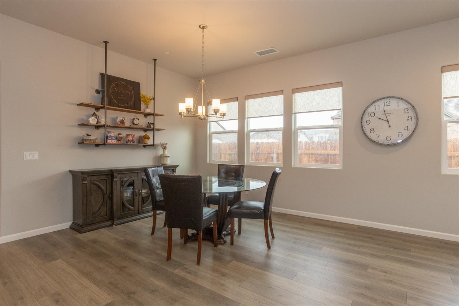 1063 Soledad Avenue Clovis, CA 93619 - Photo 8 of 26 a view of a dining room with furniture window and wooden floor
