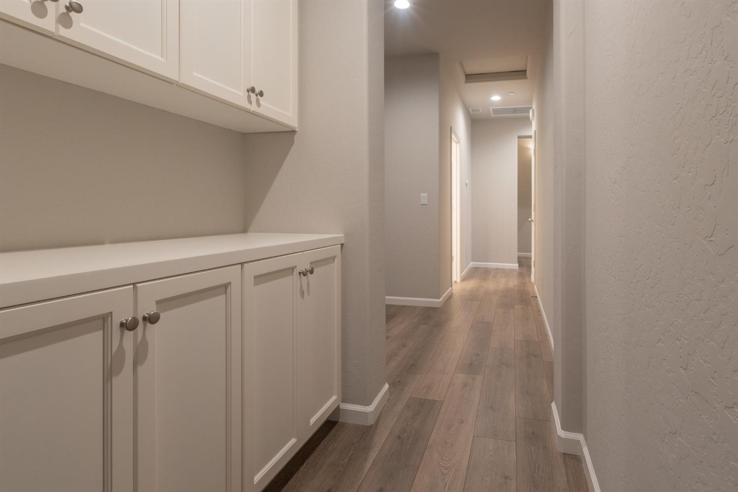 1063 Soledad Avenue Clovis, CA 93619 - Photo 9 of 26 a view of a hallway with wooden floor