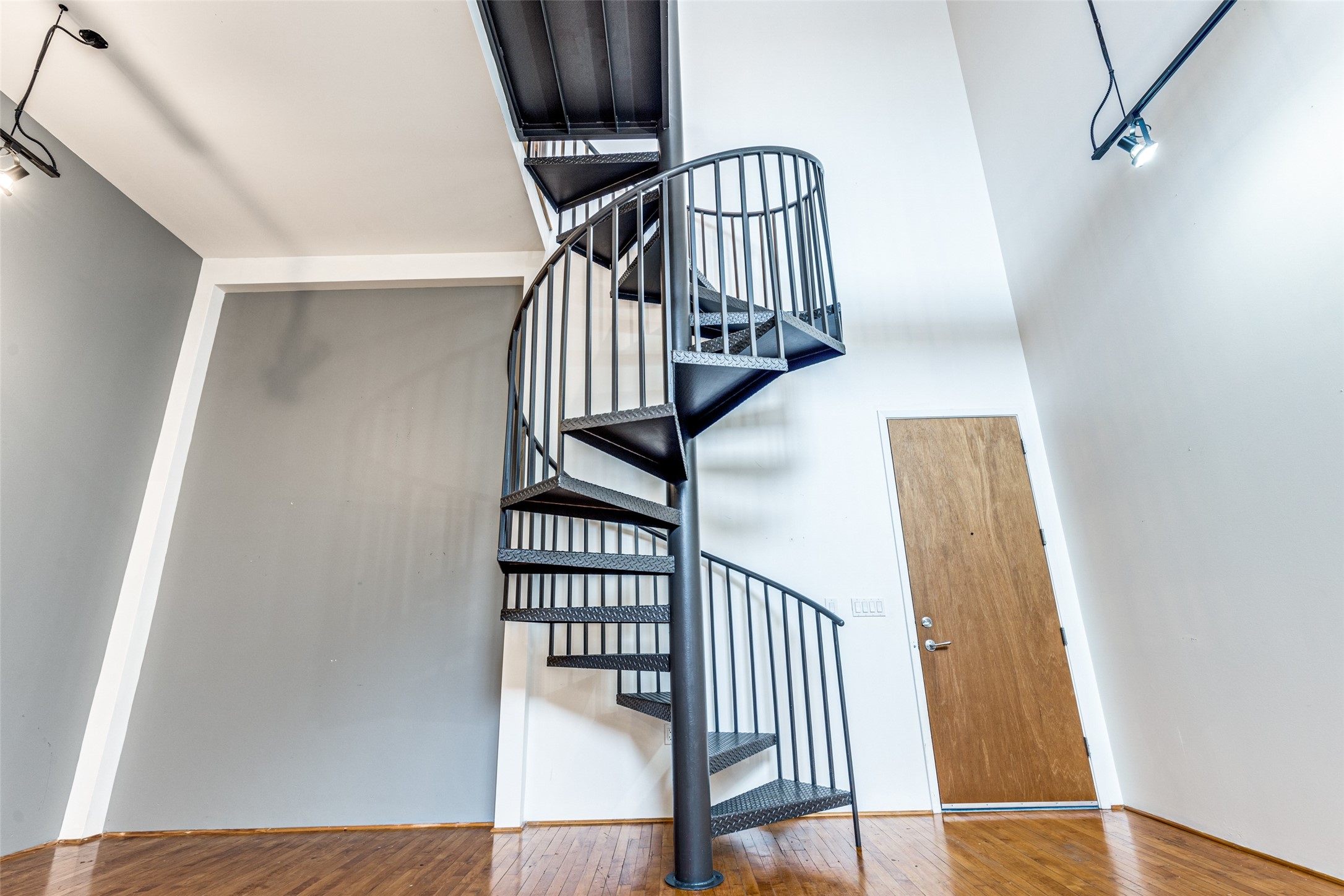 1312 Live Oak Street, Unit 223 Houston, TX 77003 - Photo 23 of 31 Architectural spiral staircase serving as a striking design feature.