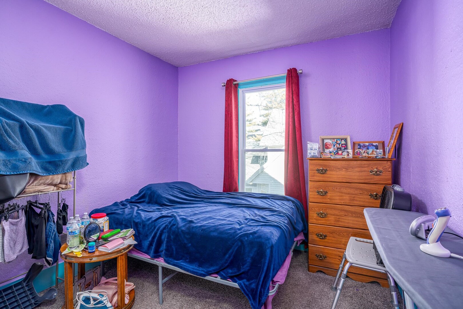 1708 Pershing Boulevard Clinton, IA 52732 - Photo 11 of 18 a bed room with a bed and a chair