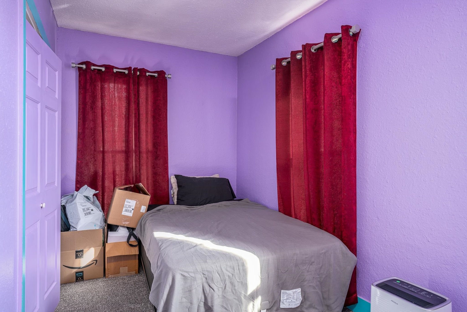 1708 Pershing Boulevard Clinton, IA 52732 - Photo 12 of 18 a bedroom with a bed a table and chair