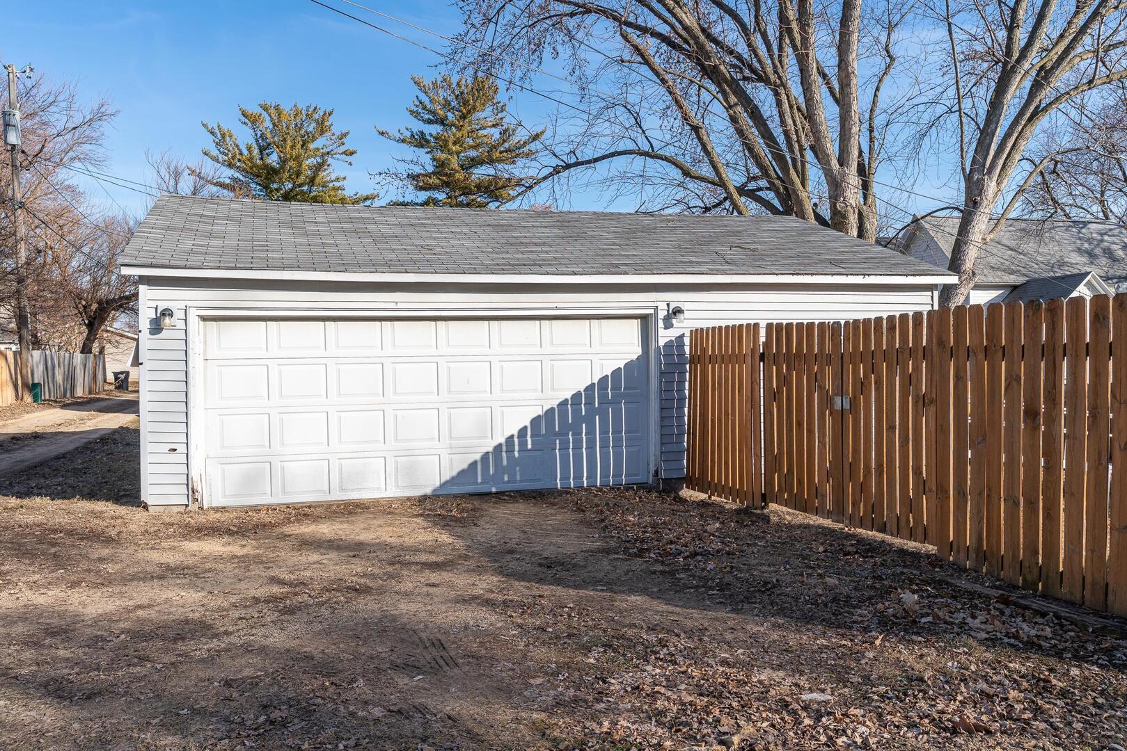 1708 Pershing Boulevard Clinton, IA 52732 - Photo 17 of 18 a view of a house with a wooden fence