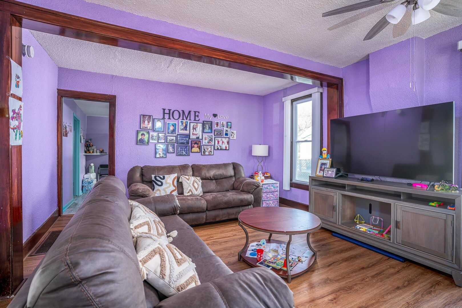 1708 Pershing Boulevard Clinton, IA 52732 - Photo 3 of 18 a living room with furniture and a flat screen tv
