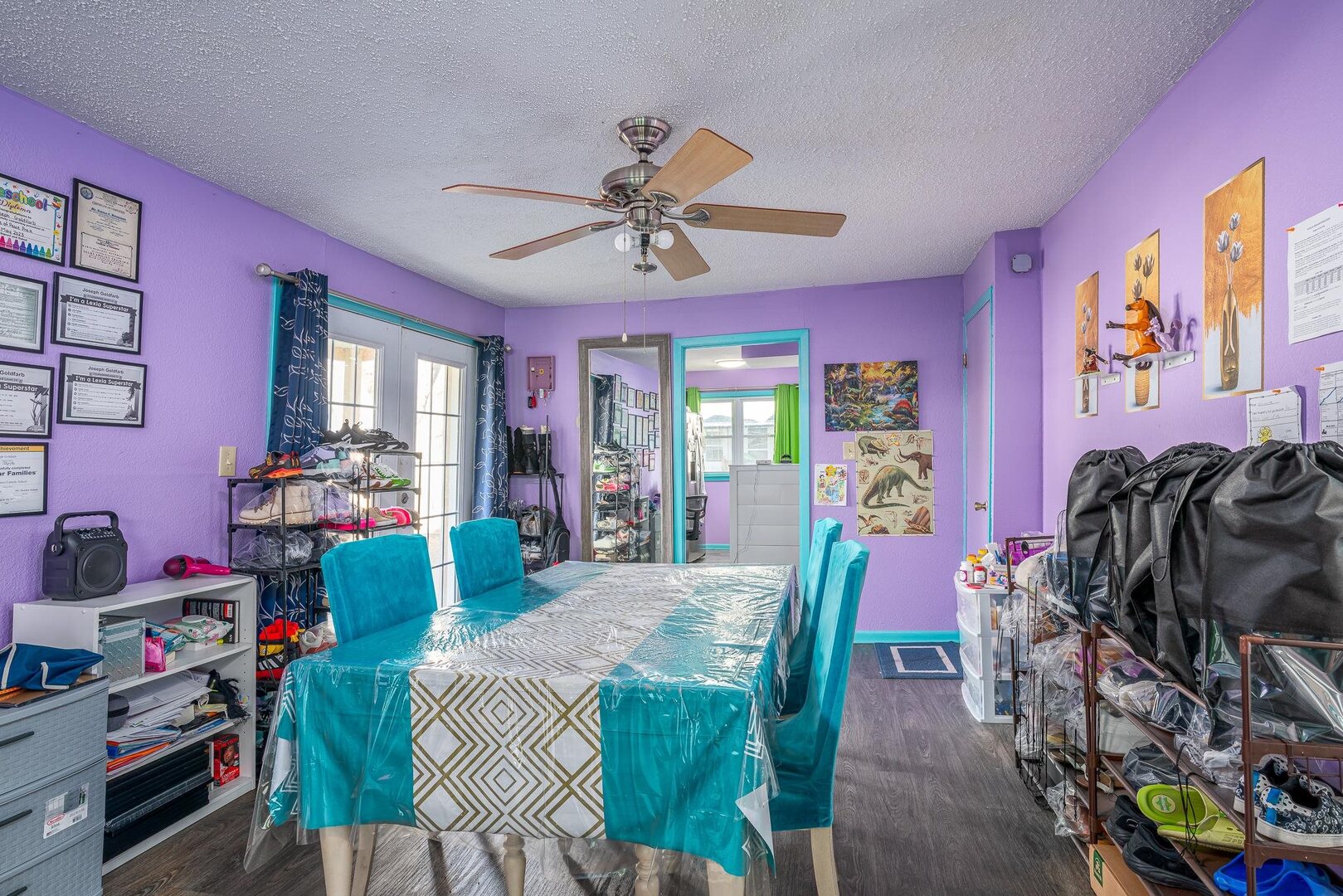 1708 Pershing Boulevard Clinton, IA 52732 - Photo 9 of 18 a living room with furniture a chandelier and a dining table