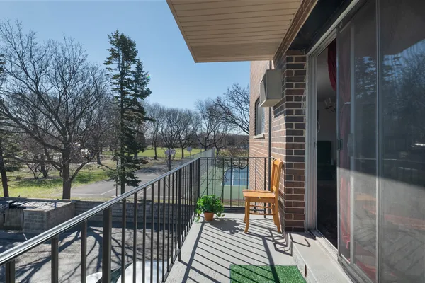 a view of balcony with furniture