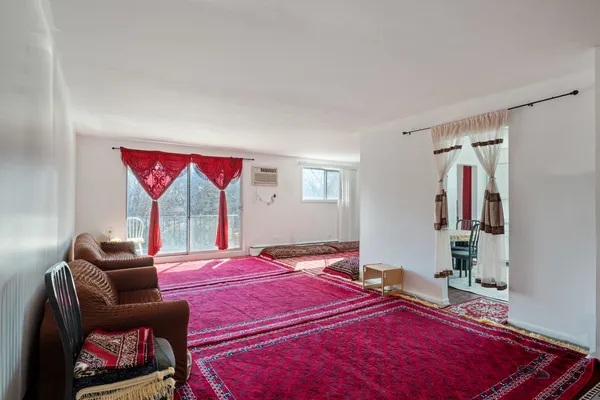 a bedroom with bed and a couch