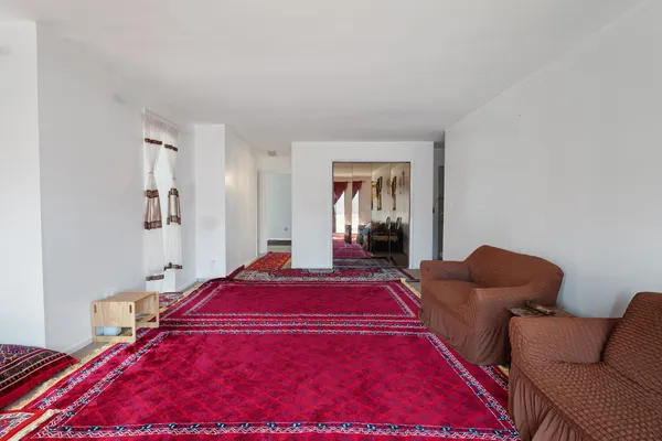a bedroom with bed and a couch