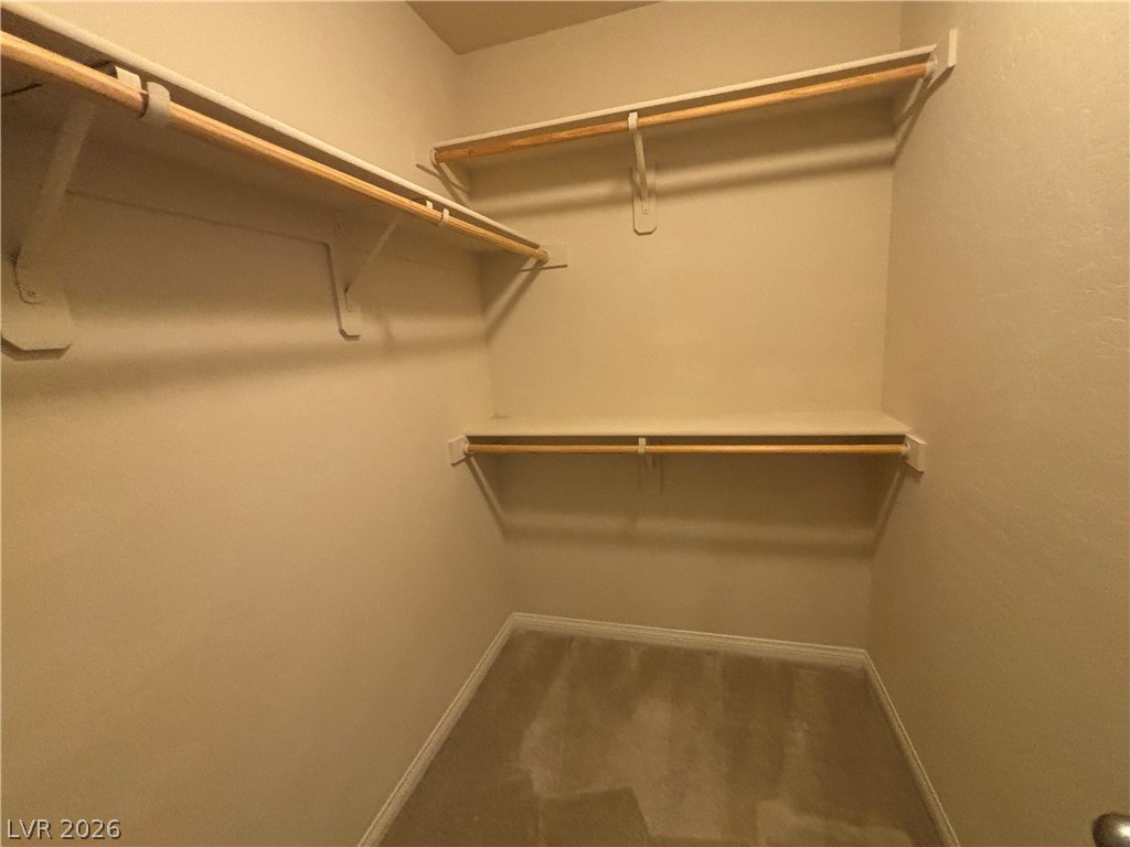 121 Elm Reed Avenue Las Vegas, NV 89113 - Photo 25 of 30 Ample closet space with built-in shelving provides practical storage solutions.